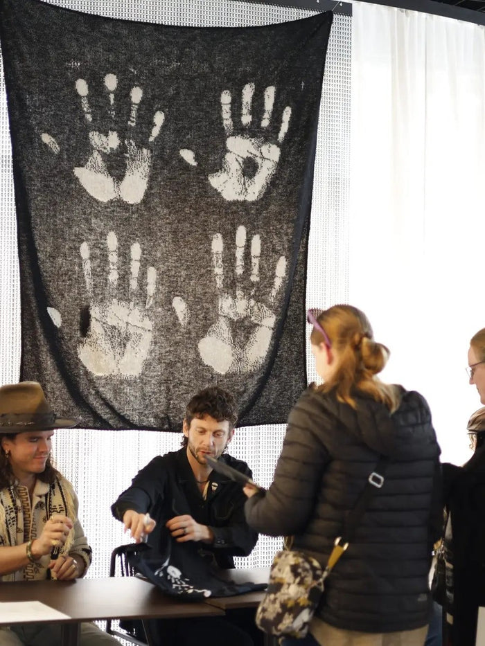Kaleo album signing — Varma handprints blanket as backdrop, sold out at concert